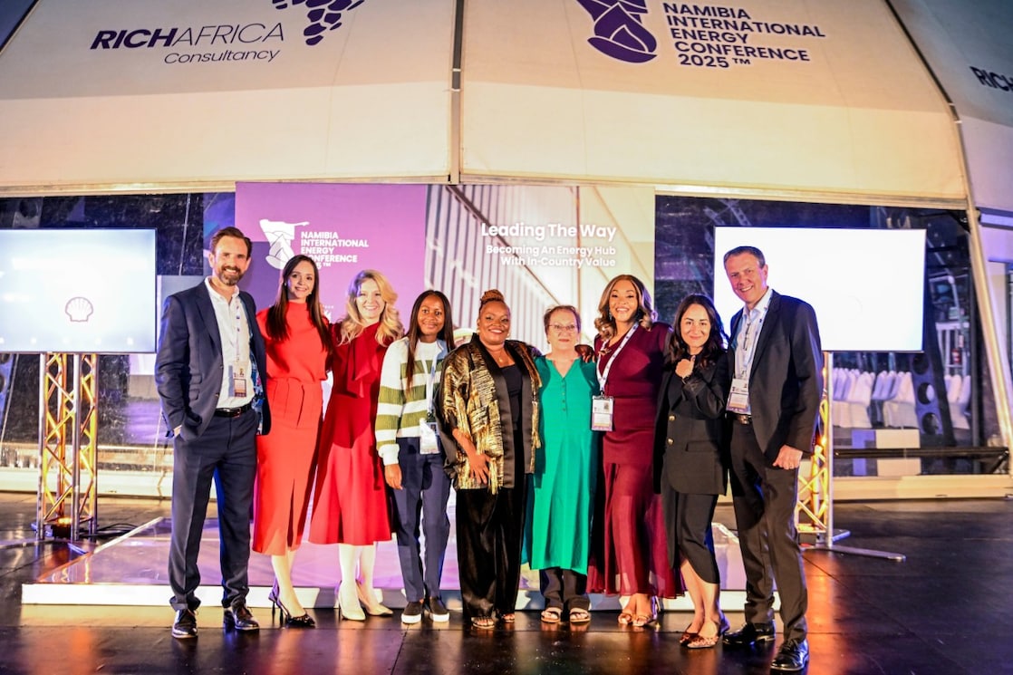 Shell delegates and event organiser on stage at Namibia International Energy Conference 2025, with event theme 'Leading The Way: Becoming An Energy Hub In The Southern Africa Region' and RICHAFRICA Consultancy banner visible.